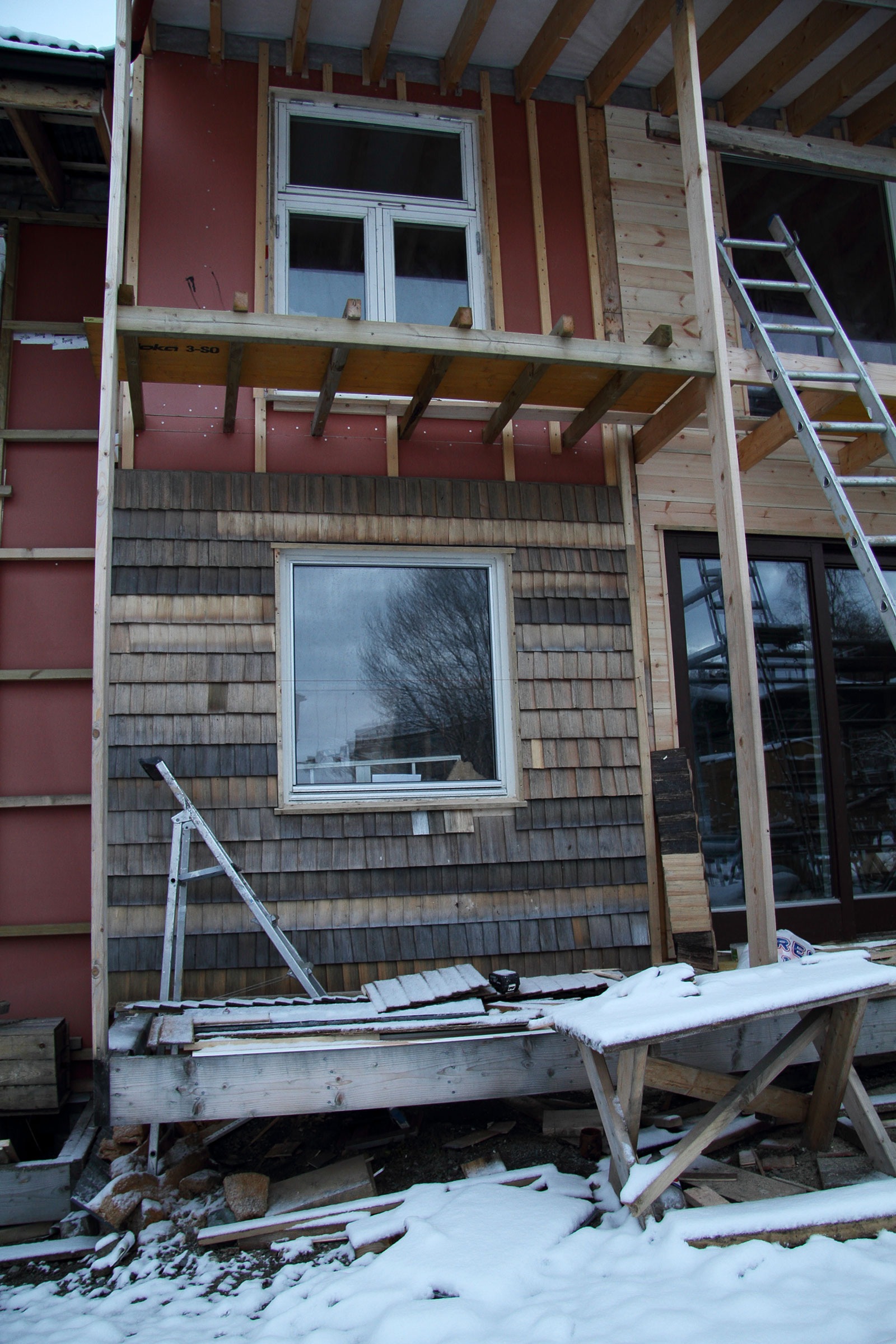 Per Kristian and Lines facade of discoloured shingles